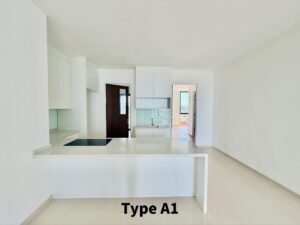 Bright, minimal white kitchen with an island, stovetop, white cabinets, and a doorway to an outdoor area.