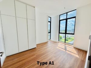 Empty modern bedroom with a tall white wardrobe and large floor-to-ceiling windows showing a city view (Type A1).