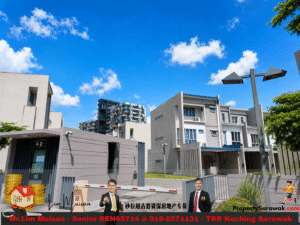 Gated modern housing complex with gray-white buildings under a blue sky; advertising banner with two men in suits at the bottom.