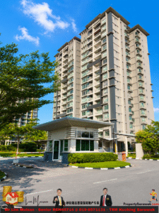 Tall beige apartment building with numerous balconies rises behind a security guard booth at a gated entrance, under a bright blue sky and green trees.