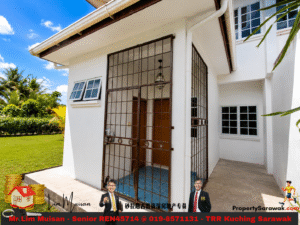 White two-story house exterior with a brown metal grid gate, white walls, blue-tiled entry, and tropical landscaping under a bright blue sky.