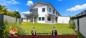 Modern two-story white/gray house in a fenced yard on a sunny day; banner in foreground features red contact text and graphics (two men in suits, a house with coins) advertising property services, including PropertySarawak.com