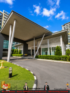 Modern building entrance with a slanted roof supported by angled columns under a bright blue sky.