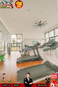 Bright gym interior with treadmills and ellipticals, large windows, and a wooden floor (property listing fitness room).