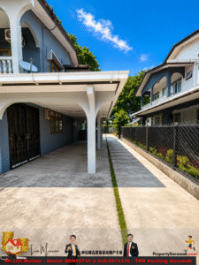 Outdoor walkway between two blue-gray residential buildings, featuring white arches, a gated door, and a fence along a concrete path with a narrow green strip in the center under a bright sky.