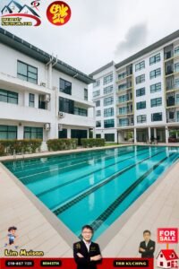 Outdoor view of a white multi-story apartment complex surrounding a long turquoise pool; sale banners and agent photos are visible around the image.