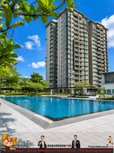 High-rise apartment building beside a large outdoor swimming pool with blue water and surrounding trees under a bright sky.
