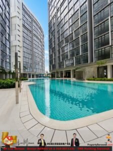 Outdoor turquoise swimming pool between modern glass high-rise buildings; light-colored pool deck and landscaping; promotional banner with agents and contact info along the bottom.