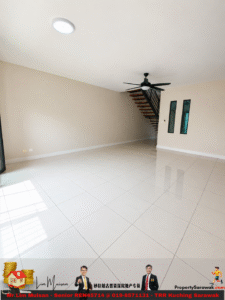 Bright, empty living room with glossy white tile floor, beige walls, a glass door on the left, a black ceiling fan, and a floating wooden staircase in the corner.
