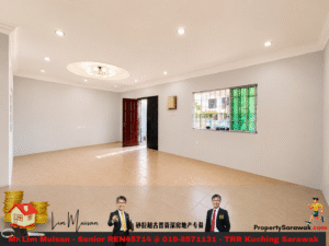 Empty living room with beige tile floor, pale walls, recessed lights, and a circular chandelier above. Two doors (red and black) and a barred window are visible.