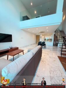 Open living area with marble floors, a grey sectional sofa facing a wall-mounted TV, a dining table, and a glass-railed staircase to a mezzanine.