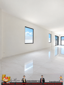 Bright empty modern room with white walls and large windows showing blue sky; highly glossy white tiled floor reflects light.