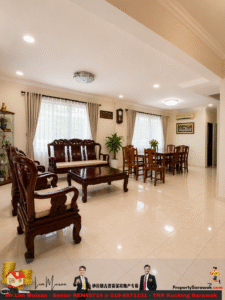 Elegant living and dining room with dark carved wood furniture, two large windows with sheer curtains, and potted plants.