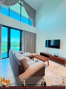 Modern living room with large windows, grey curtains, beige sectional sofa, wooden coffee table, and a wall-mounted TV. Bright outdoor view visible through the glass doors.