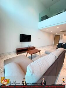 Modern living room with marble floor, wall-mounted TV, wooden media console, L-shaped gray sofa, and a coffee table under a glass-railed mezzanine.