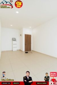 Empty, minimalist room with beige tiles, white walls, a wooden door, and a small white cabinet; slippers on the floor and sale banners in corners.