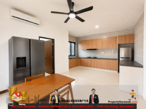 Open-plan kitchen with wooden cabinets, stainless steel fridge, and a wooden dining table in the foreground.