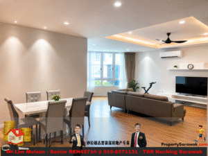 Open-plan living and dining room with marble dining table, gray chairs, a large gray sofa, TV, ceiling fan, and big windows with sheer curtains.