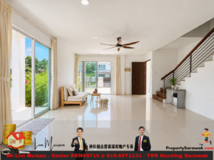 Bright, airy living room with large glass doors to a garden, cream sofa, coffee table, and a wooden staircase along the right wall; doorway to outside visible. Includes advertising banner at bottom.