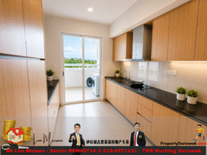 Modern kitchen with light wood cabinets, black countertop, and stainless range hood; sliding door to balcony with a washing machine outside.