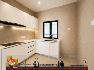 Modern L-shaped kitchen with white cabinets, beige tile walls, and a window above the sink.