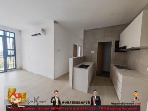 Bright open-plan living area with a large glass door to a balcony on the left and a modern white kitchen on the right. Buggy promotional overlay at the bottom shows agents and contact info.