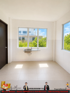 Empty utility/kitchen area with a stainless steel sink under a large window, white tiled walls, and beige floor; door on the left.