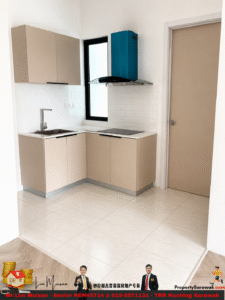 L-shaped kitchen with beige cabinets, white tile backsplash, stainless sink, induction cooktop, and a teal range hood by a window.