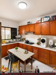 Bright L-shaped kitchen with wooden cabinets, white countertops, gas stove, sink by a window, and a small checkered table in the center.