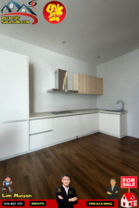 Modern white L-shaped kitchen with a stainless steel range hood, light wood cabinet, white cabinetry, and dark wood flooring; overlaid logos and a red bottom banner with 'FOR SALE'