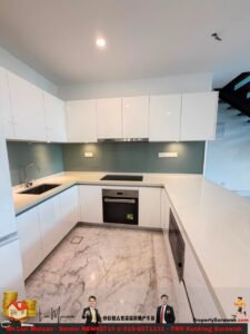 L-shaped modern kitchen with white glossy cabinets, teal glass backsplash, and marble floor; built-in oven and induction hob center-stage.
