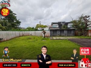 Vacant grassy backyard with a modern two-storey house behind a concrete wall; foreground shows 'For Sale' sign and real estate banners/silhouettes.
