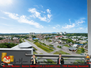Wide cityscape of a suburban town under a blue sky, seen from a balcony with a banner advertising Mr Lim Muisan, Senior REALTOR in Kuching, Sarawak.