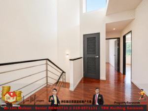 Bright modern hallway on a stair landing with white walls, a metal handrail, and a dark louvered door.