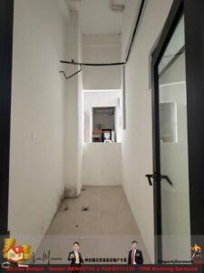 Narrow white indoor hallway with tiled beige floor, a glass door on the right, exposed wiring along the ceiling, and a view into a back room at the far end.