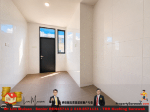 Bright white-tiled hallway with a black door and two tall windows at the end. (informative)