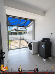 Laundry room with a white front-loading washing machine and a dark dryer beside a large metal-framed window; blue canopy visible outside.