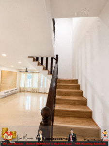 Modern living area with a wooden staircase along white walls, glossy tile floor, and large windows with sheer curtains.