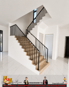 Modern interior staircase: wood steps with black metal railing in a bright, open white-walled foyer.