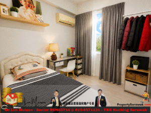 Cozy bedroom with a tufted cream bed, striped gray and white duvet, a desk with lamp, and a coat rack holding red and black jackets by a window with gray curtains.