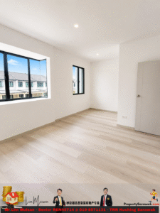Bright empty white room with wooden floor, two rectangular windows and a closed door on the right.