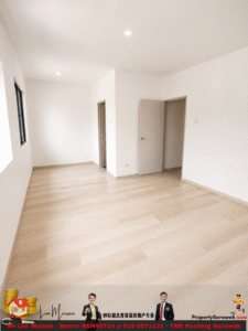 Empty white-walled room with a light wood floor, window on the left, and two doors along the right wall (one open).