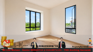 Bright empty room with light wood floor and two large black-framed windows letting in daylight.