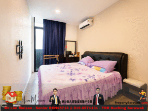 A modern bedroom with a black upholstered bed, purple floral bedding, matching pillows, dark blue curtains, and a wall-mounted air conditioner.