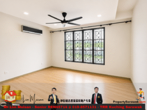 Empty beige living room with a large black-framed decorative window, ceiling fan, and wall-mounted AC.