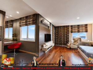 Bright, modern living area with hardwood floors, wall-mounted TV, and a massage chair by large windows with brown patterned curtains.