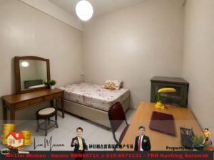 Small bedroom with a twin bed, floral bedsheet, wooden vanity with mirror, stool, and a desk with a laptop.