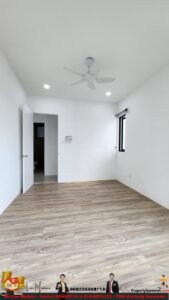 Empty white room with wood-textured flooring, a ceiling fan, and two recessed lights; open door to a small bathroom on the left and a window on the right side of the wall.