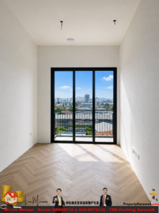 Empty modern room with black-framed glass doors opening to a balcony and city skyline outside on a sunny day.