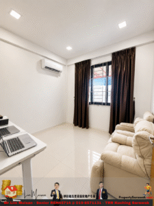 Bright minimalist home office with two laptops on a white desk, beige sofa, and a window with dark curtains.